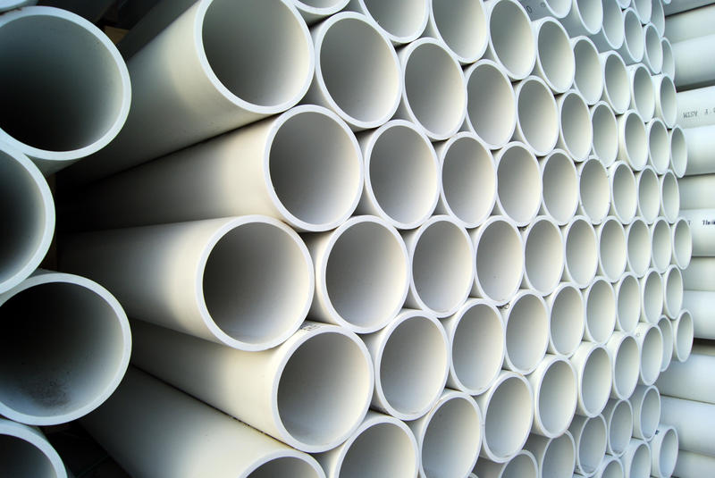 Big stack of white PVC pipes
